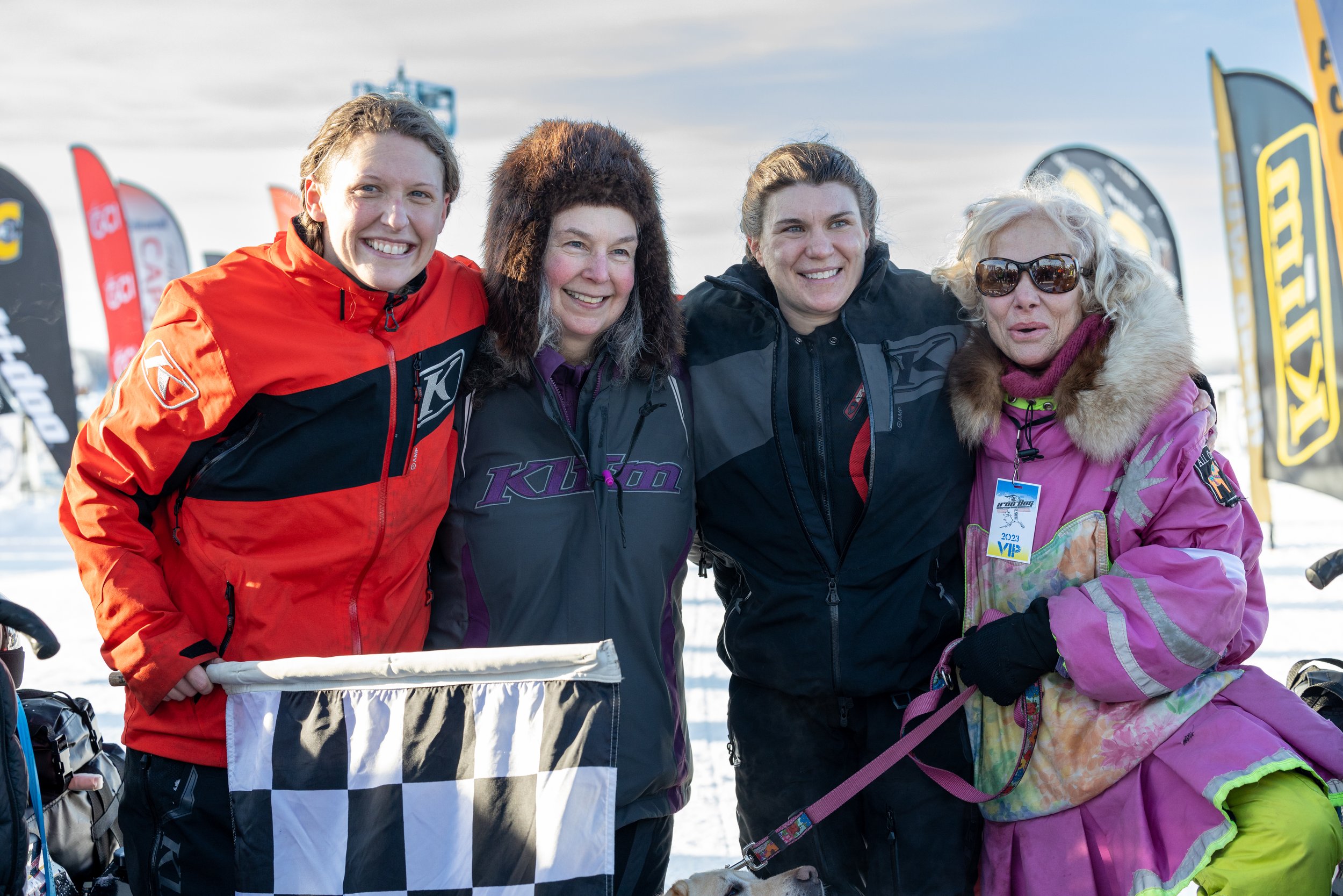 Team 16 Hillarie Gossett (left) and Ashley Wood (third from left) celebrate their rookie finish of Iron Dog 2023 with legendary dog musher DeeDee Jonrowe (far right) and Dianna Blakley (second from left), who was in the Expedition Class in 2022. Gossett and Wood became only the second all-female team to complete the Iron Dog Pro Class, and the first all-women team to complete the longer route that includes the Red Dog Loop. Megan Rolinger photo