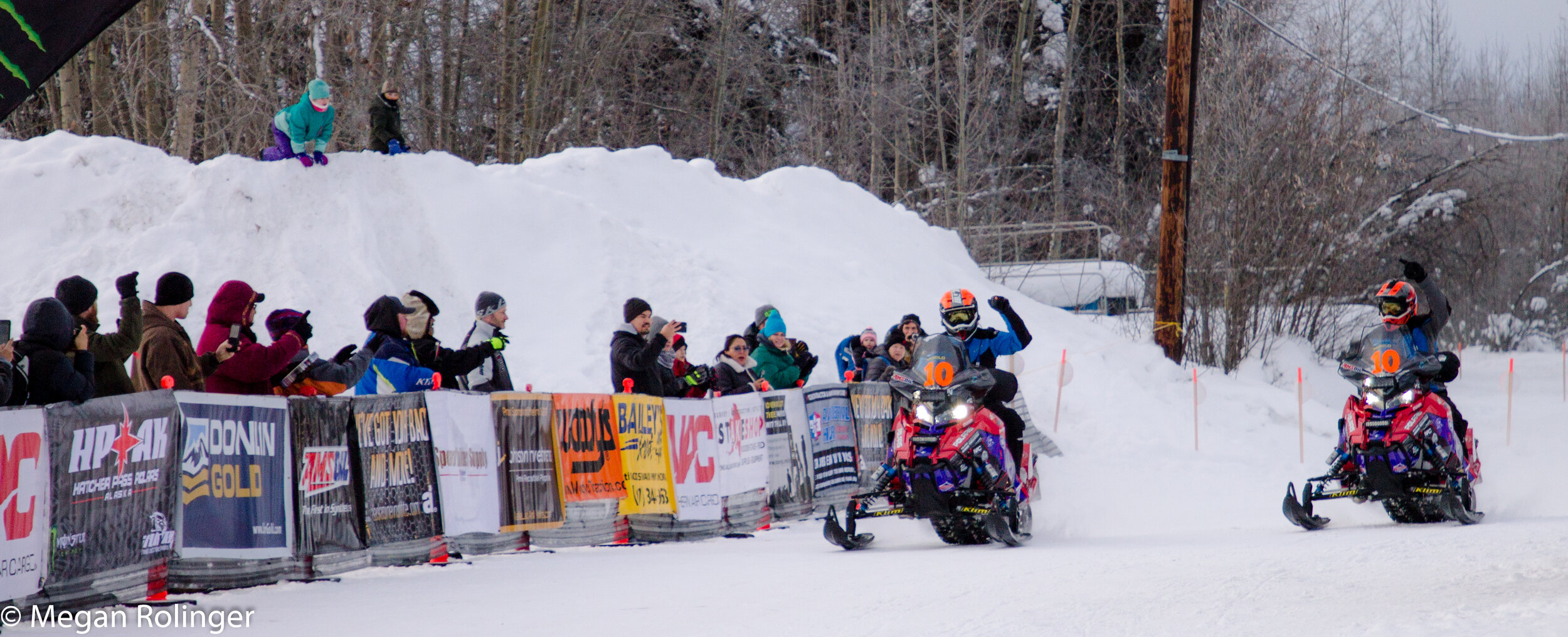 Megan Rolinger Team 10, Mike Morgan and Chris Olds, celebrate in Fairbanks as they race to 2019 victory. It was the second win in a row for the longtime team.