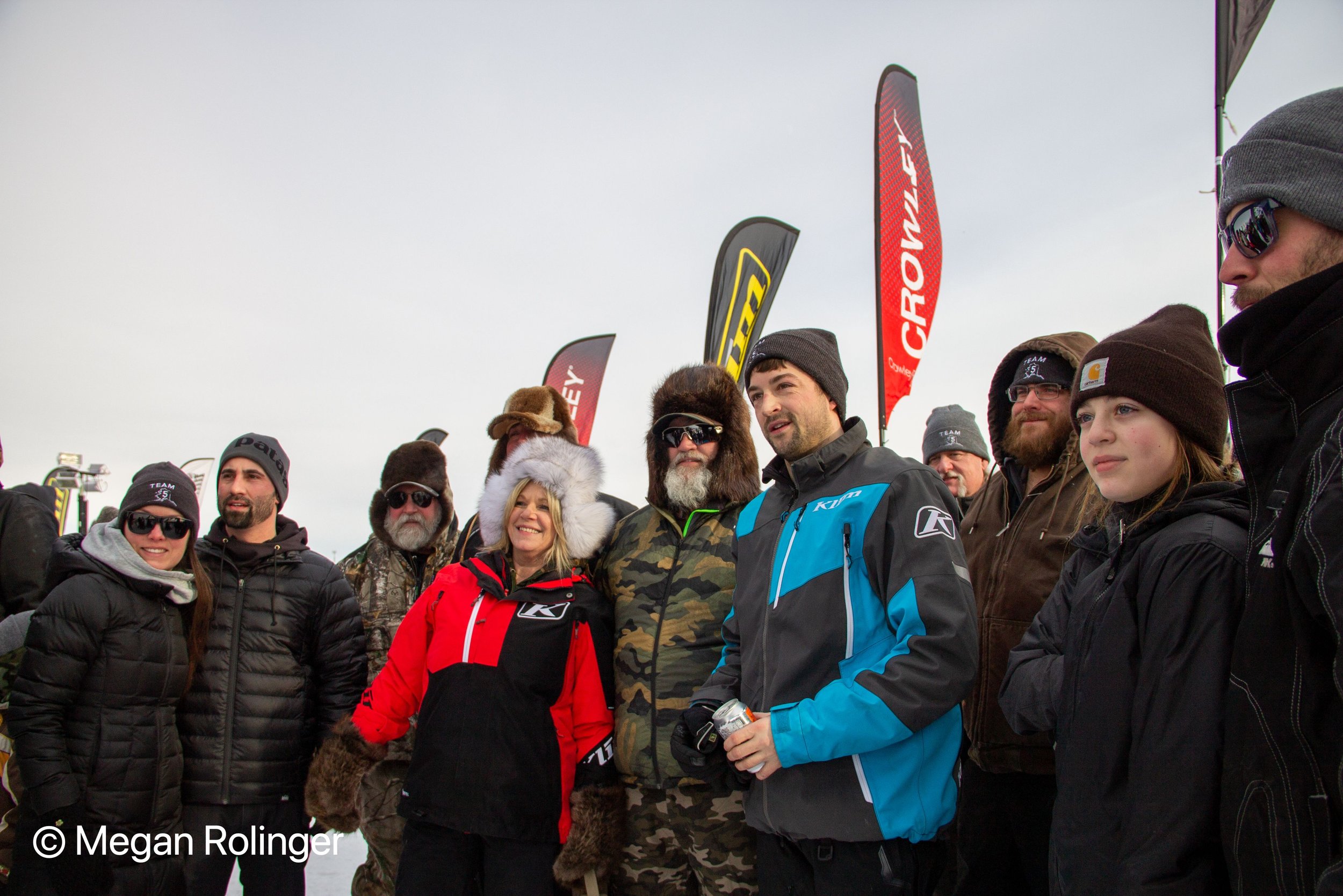 Iron Dog Pro Class racer Zack Weisz, shown here at the finish of the 2021 race, will be joining the Expedition Class this year, to ride with his father, David, center, and three uncles. He plans to return to pro racing after the gap year. Photo credit: Megan Rolinger