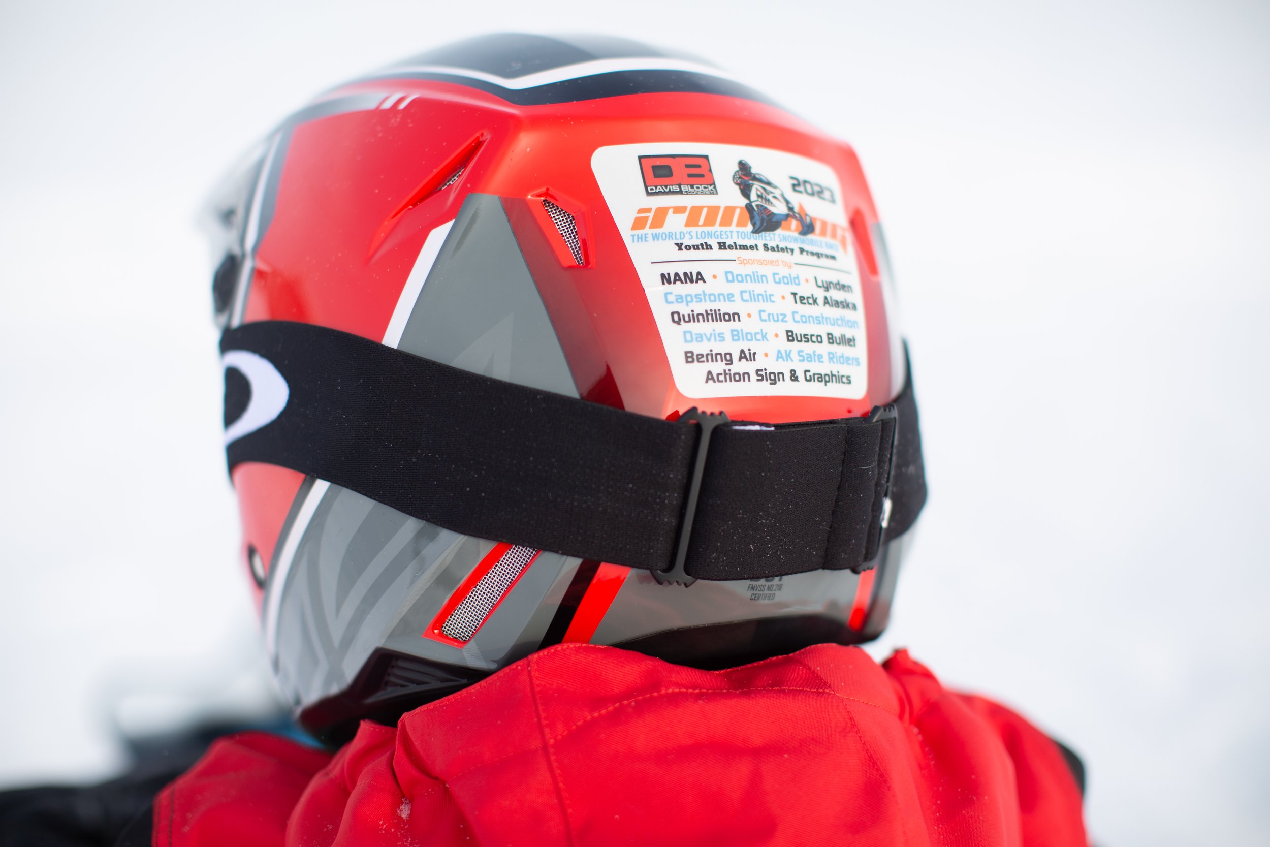 A young Nome rider sports goggles and a new Iron Dog helmet, complete with the custom Iron Dog stickers made specially for each region. Taylor Booth photo