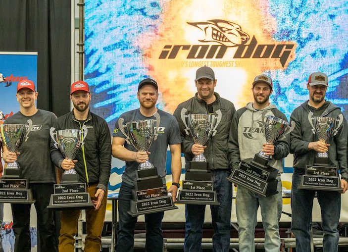 Teams 10 (Chris Olds, Mike Morgan), 7 (Tyler Aklestad, Nick Ousted) and 9 (Troy Conlon, Shane Barber) celebrate their podium finish during the 2022 Iron Dog banquet.