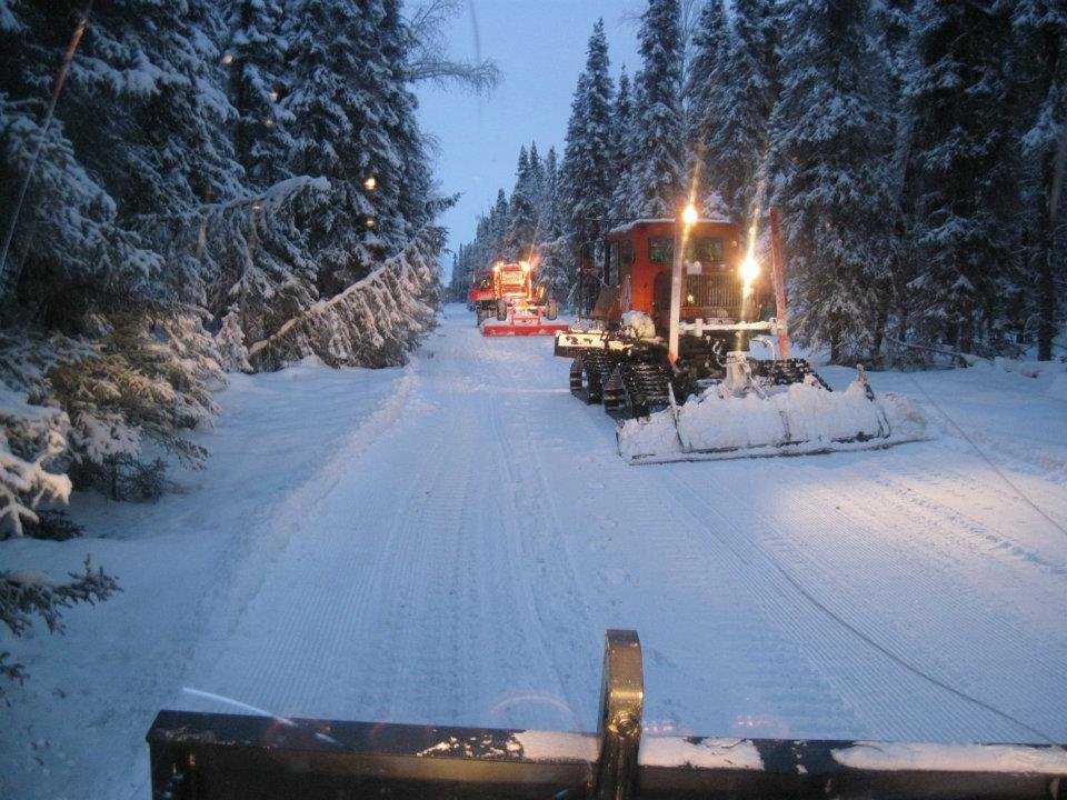 Groomers work into the night to prep the trails. Well-groomed trails make it safer to ride, and more enjoyable as well. Credit: Montana Creek Motor Mushers