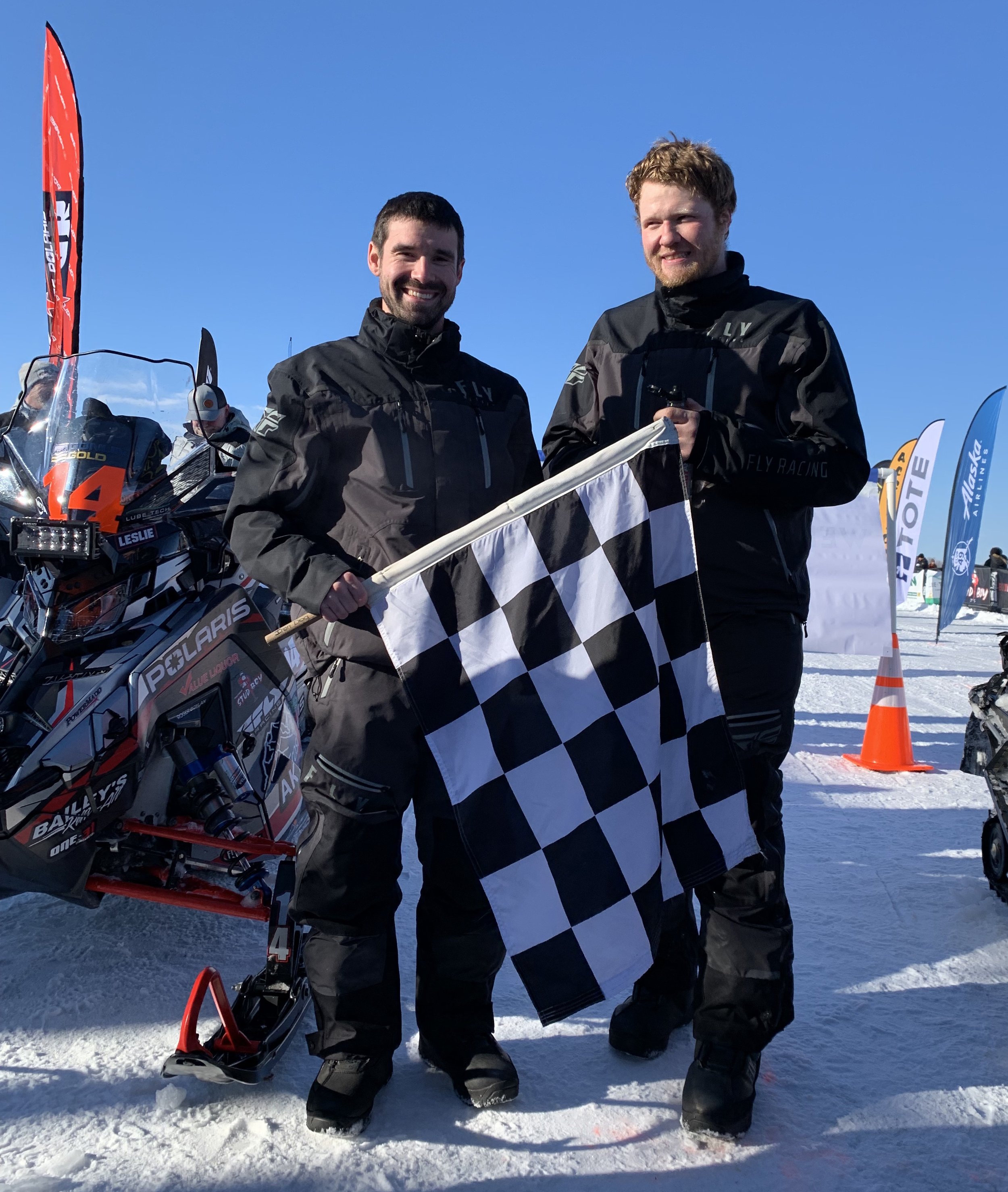 Team 14 Bryan Leslie and Casey Boylan celebrate at the Iron Dog finish. Their second-place finish earns them a $40,000 cash prize. Iron Dog photo