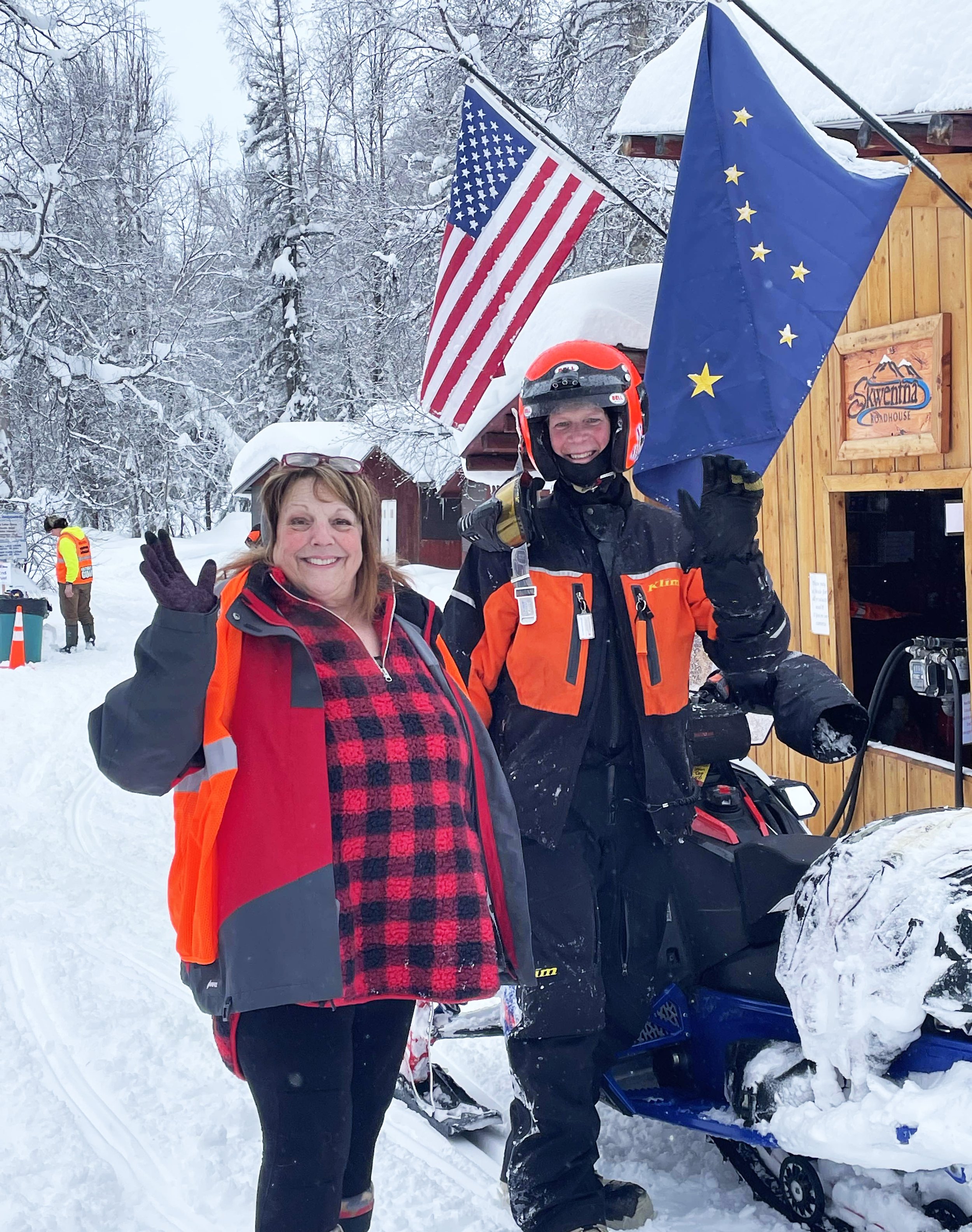 Expedition Class rider Randy Bedard from Team 50 mugs for the camera with Skwentna Roadhouse owner Cindy Herman on Thursday, Feb. 17. Expedition Class riders are on their way to McGrath today. Courtesy Cindy Herman
