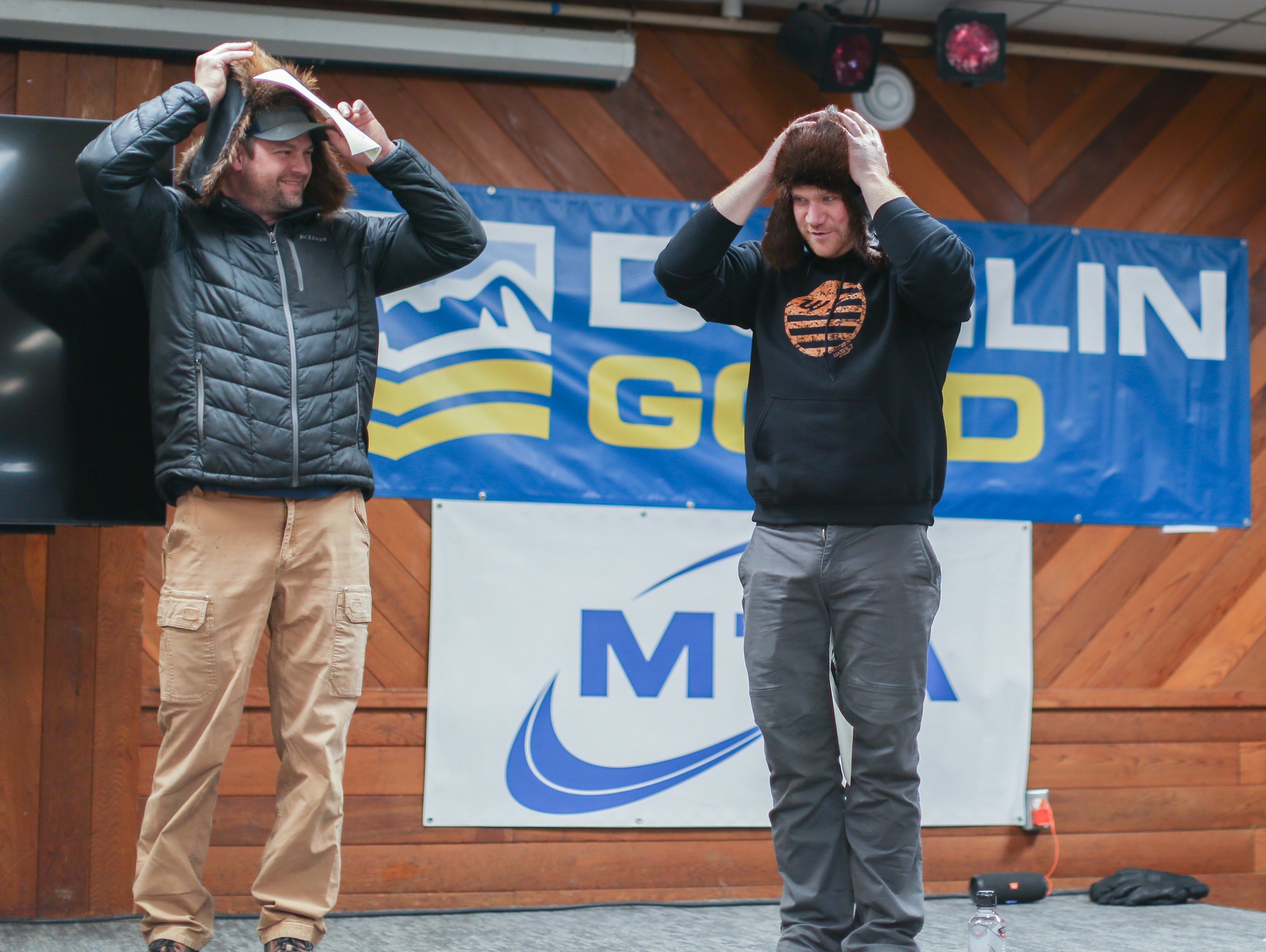 Team 7’s Nick Olstad and Tyler Aklestad try on their handmade beaver fur hats, a surprise contingency prize from Noorvik. Taylor Booth photo