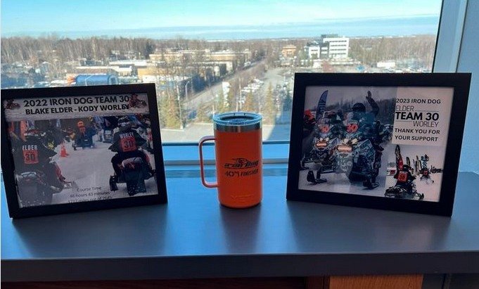 Team 30’s Kody Worley and Blake Elder, demonstrated their Alaska Iron Dog hospitality when helping Kim Bergeron recover after falling into a river. Their kindness paid off, as they both went on to earn veteran status — and this orange finisher Yeti gifted to each of the 2024 finishers.